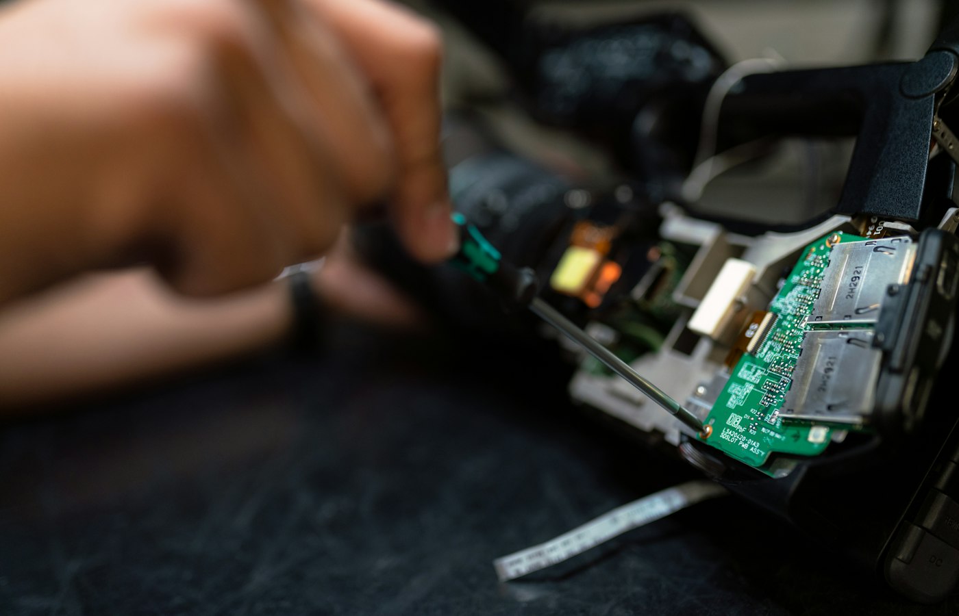 Breadboard, jumper wires and a microcontroller on a workbench
